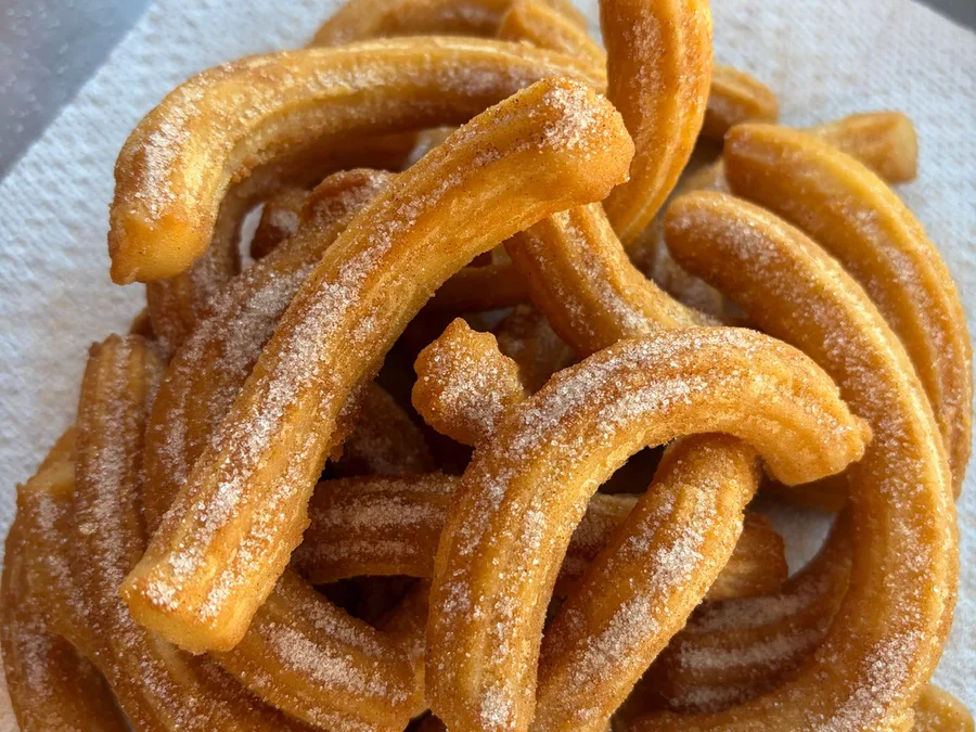 Freshly fried churros dusted in cinnamon sugar